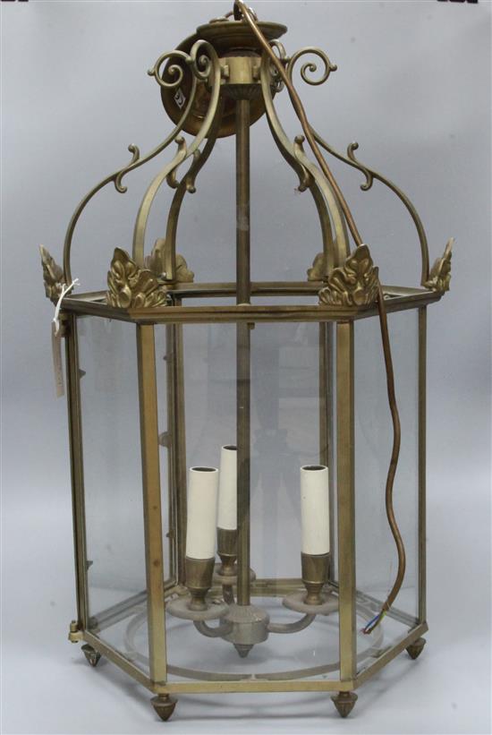 A brass hexagonal hanging hall lantern (one glass panel deficient)